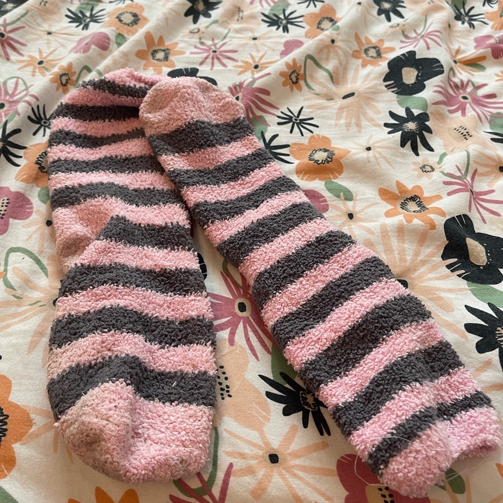 Worn and used women’s fuzzy socks